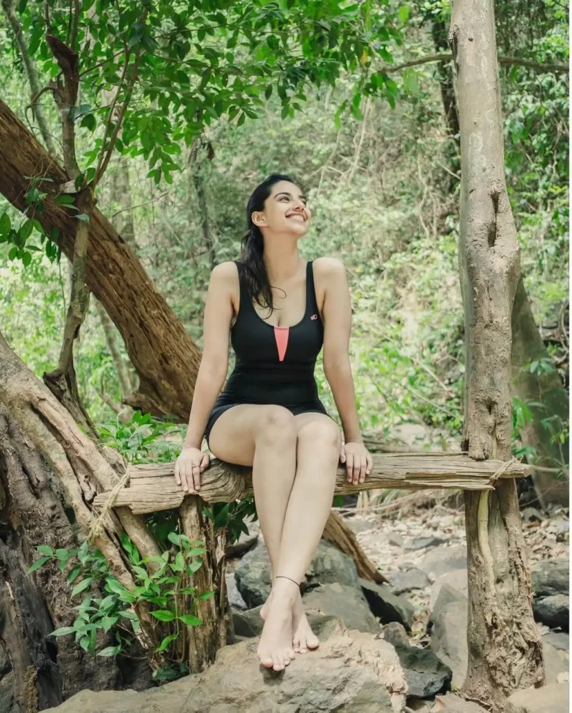 Meenakshi Chaudhary in Black monokini in forest